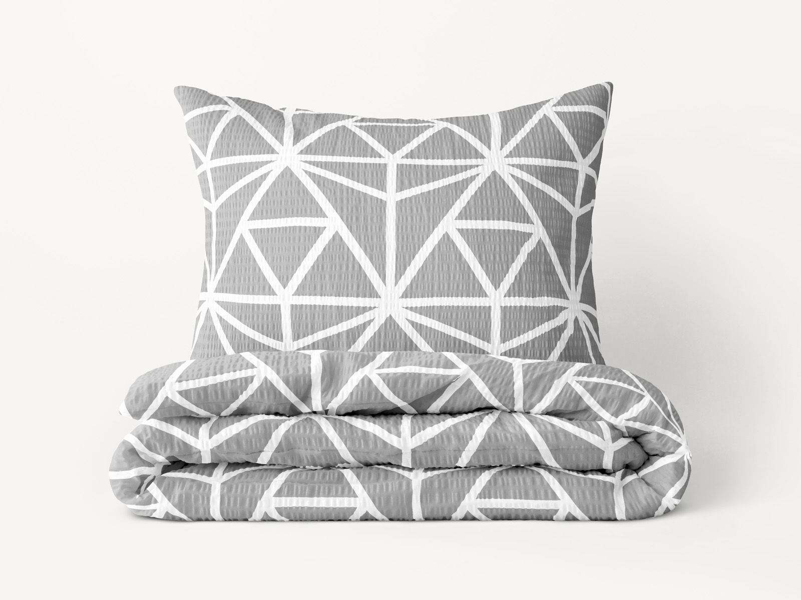 Krepové posteľné obliečky Deluxe - biele geometrické tvary na sivom